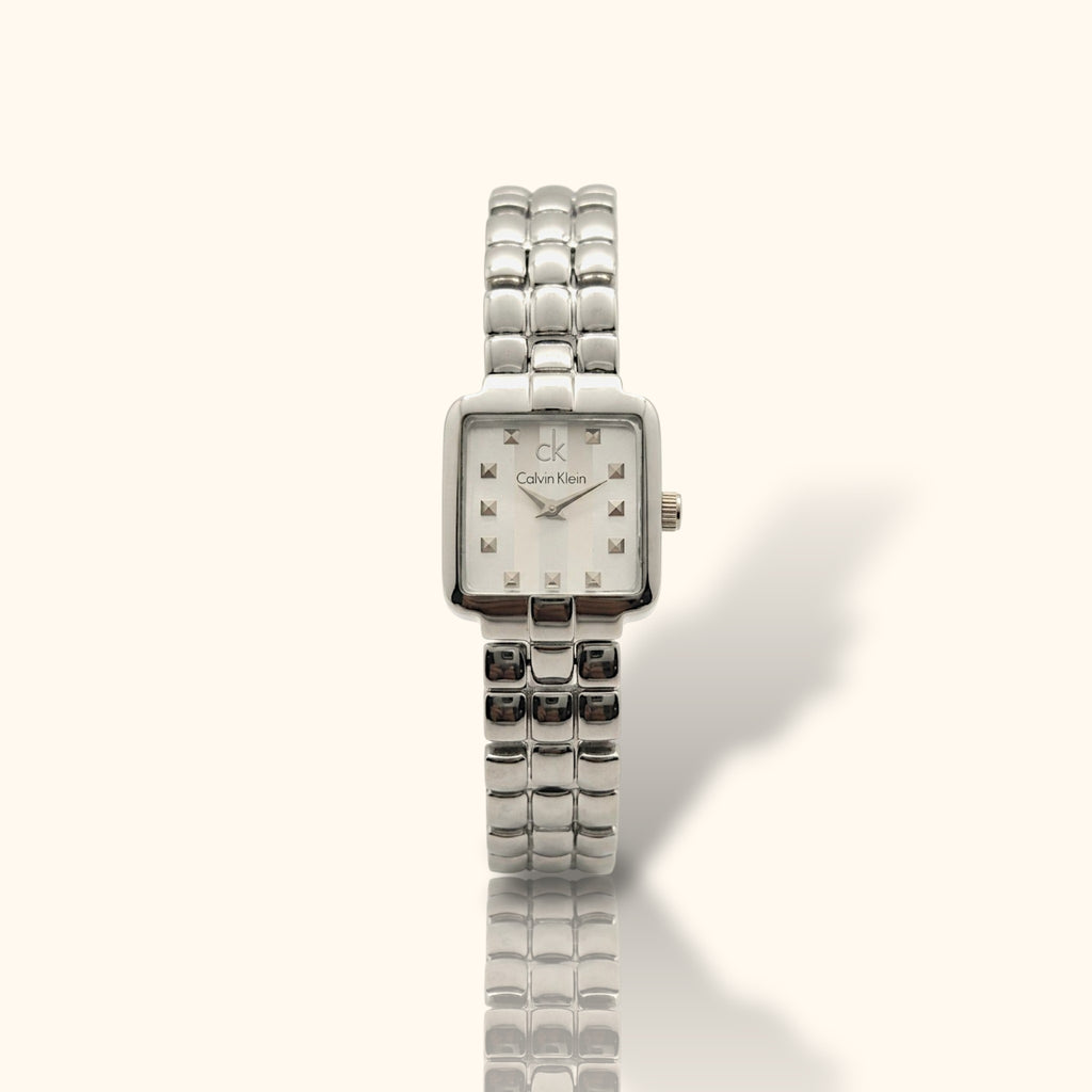 Calvin Klein Silver Essence – Square Dial All-Silver Women’s Watch